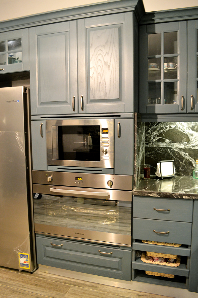 Blue oak kitchen with built in appliances