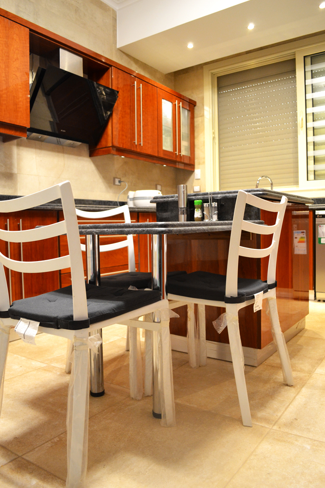 modern brown kitchen with cherry veneers with dining area مطبخ مودرن