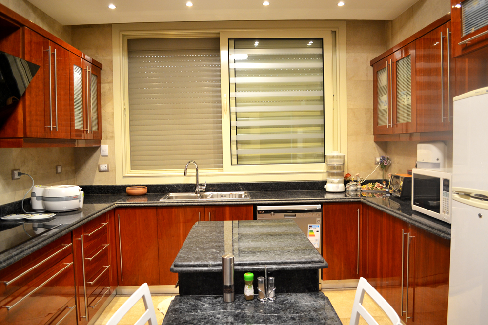 modern brown kitchen with cherry veneers