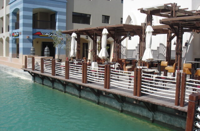 Casbah restaurant wooden deck dock with ropes and wooden poles