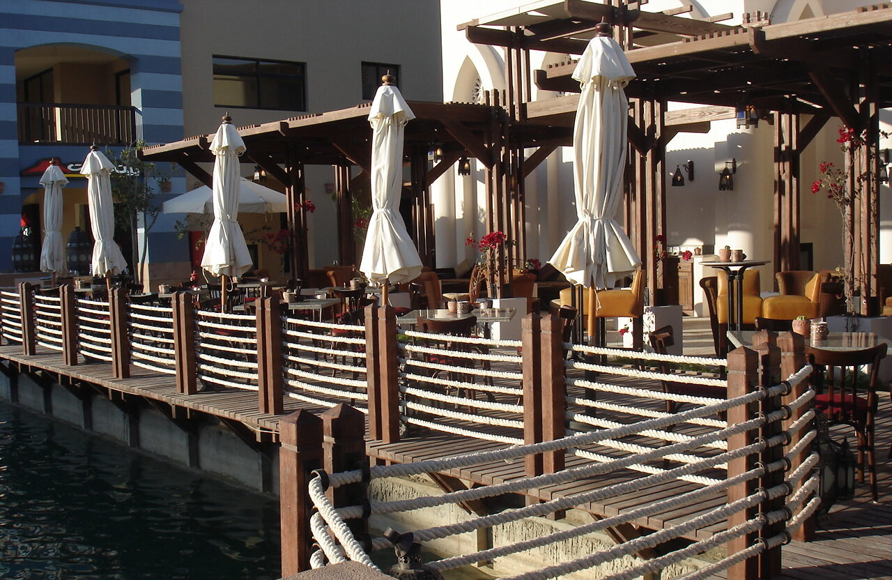Casbah restaurant wooden deck dock with ropes and poles