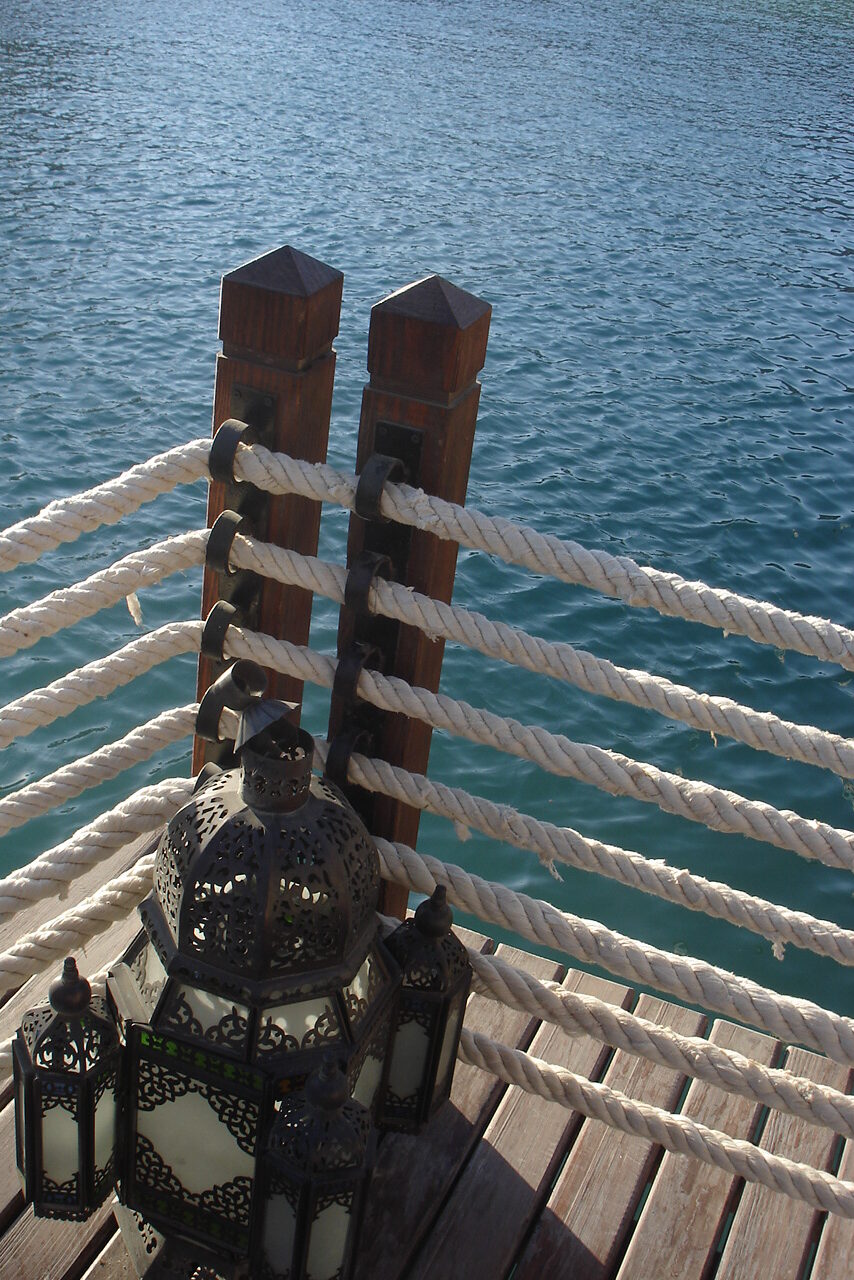 Casbah restaurant wooden deck dock with ropes and poles