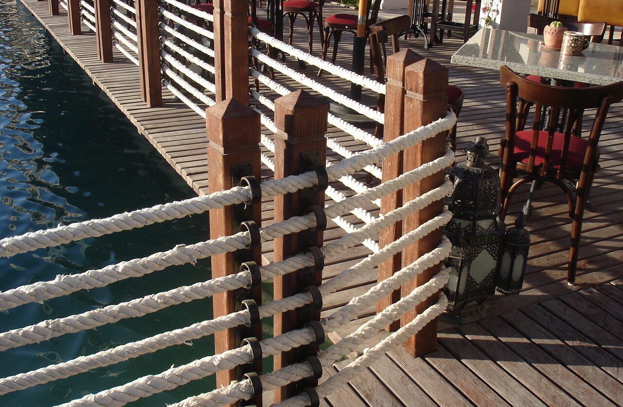 Casbah restaurant wooden deck dock with rope and poles