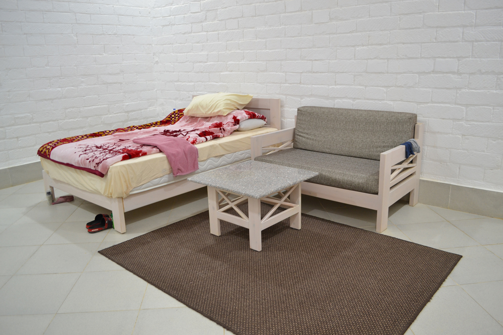 Canal Sugar Staff accommodation room white closetroom white bed, couch, table