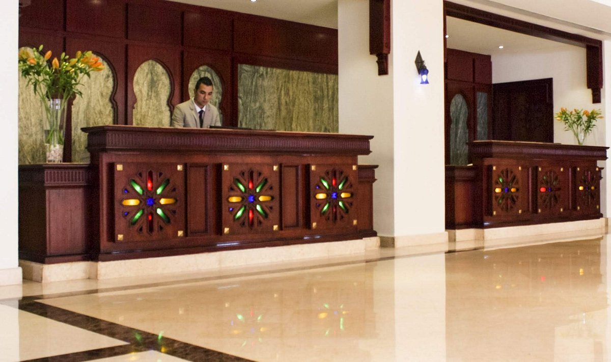 Baron resort wooden front desk with stained glass